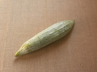 Greenish white color raw whole Snake gourd or Trichosanthes cucumerina