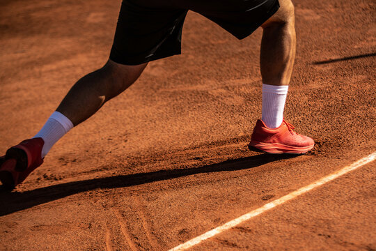 close-up of a foot slip on a clay tennis court
