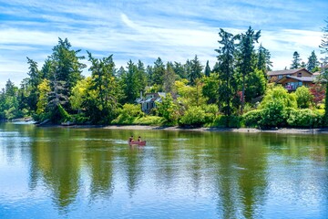 A bright sunny day attracts boaters to the calm reflective waters of the Gorge ocean inlet near...