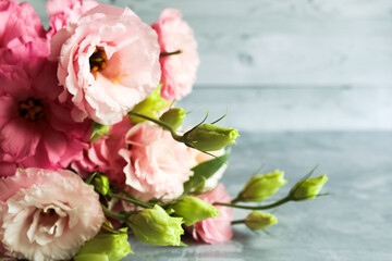 Bright bouquet with eustoma. Bouquet on soft gray background