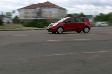 Fototapeta na wymiar city traffic motion blurred passenger car in motion