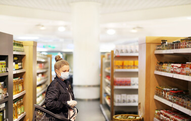 supermarket shopping, face mask and gloves,Woman choosing a dairy products at supermarket