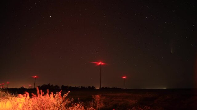 Timelapse of comet Neowise C/2020 F3 on the dark night sky, astronomy and space concept