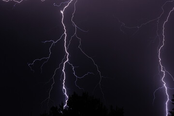 Dual lightning strikes during a desert monsoon storm at night