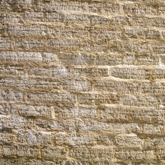 stone wall of roughly cut limestone blocks of different sizes as a background