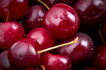 close up view for fresh dark sweet cherry with drops. healthy eating concept.