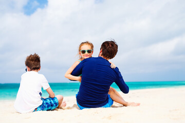 Father with kids at beach