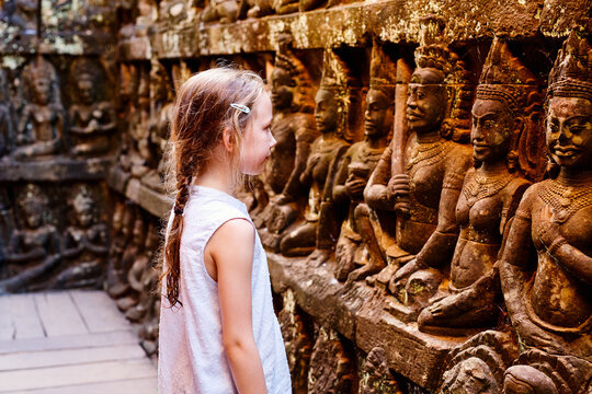 Little girl visiting cambodian temples