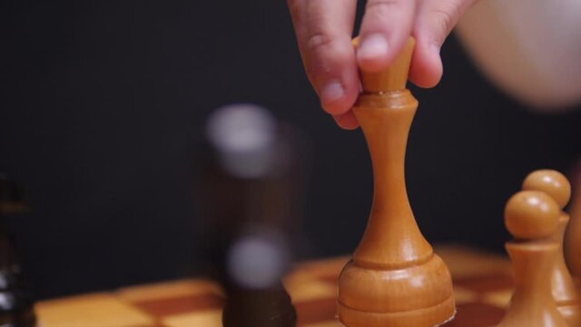 White chess queen hit black queen, track slow motion.