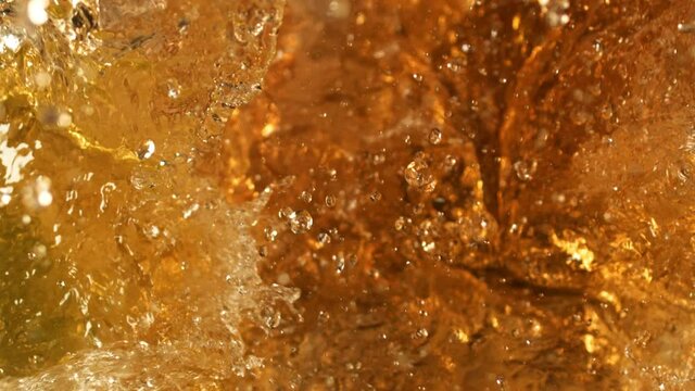 Juicy and healthy cold-press explosion. Refreshing natural juice splashing in extreme slow-motion. Beautiful and clear yummy juicing. Cold Press juicing in slow-motion.