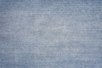 Texture of denim light blue fabric. Background, close-up.