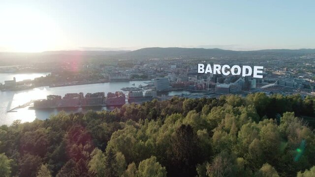 Aerial view of downtown Bj&oslash;rvika and forest in Oslo with sticky Barcode 3D title