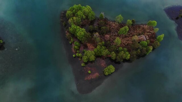 4k drone footage. An Island in  a green  glacier lake in Norway
