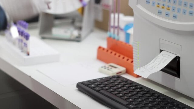 Biochemist analyzing blood samples at a Laboratory