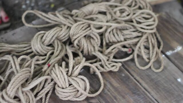 Shibari ropes on a wooden platform 