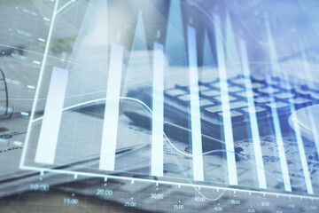 Obraz premium Double exposure of financial chart drawings and desk with open notebook background. Concept of forex market