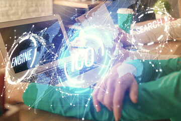 Double exposure of man and woman working together and crypto finance theme hologram. Blockchain...