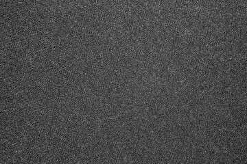 The texture of a dense gray carpet.Grey carpet background.