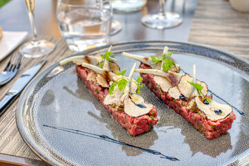 Beef tartar with black truffles and artichoke