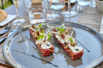 Beef tartar with black truffles and artichoke