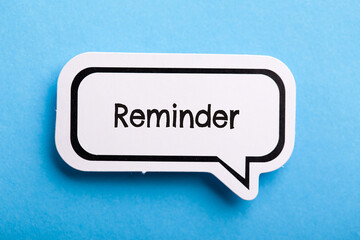 Reminder Speech Bubble Isolated On Blue Background