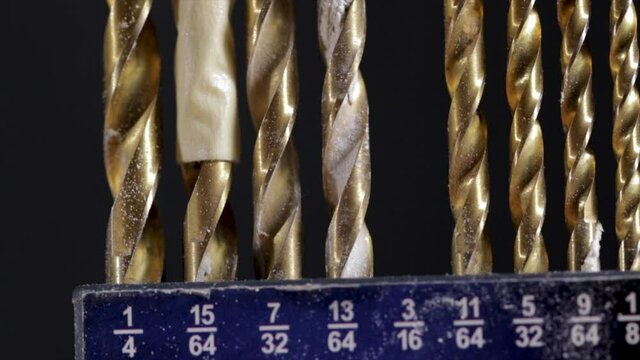 Metal drill bits close up set of titanium bits for drilling in metal and wood. Tool box for DIY home repair. 