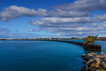 The long sweeping seawall protecting the harbor in Marigot, Saint Martin