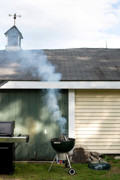 A charcoal grill smoking