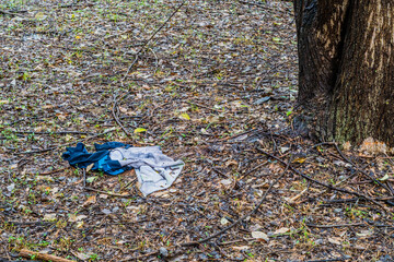 Discarded blue and gray cotton jumper