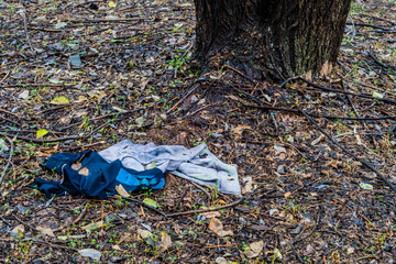 Discarded blue and gray cotton jumper