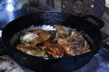 cooking fish in a pan