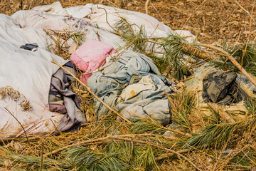 Dirty old used discarded clothes