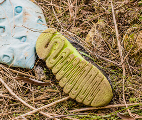 Athletic shoe laying on ground