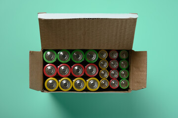 set of batteries on green background