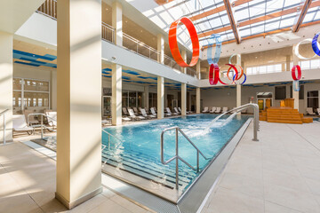 Indoor swimming pool in hotel spa and wellness center