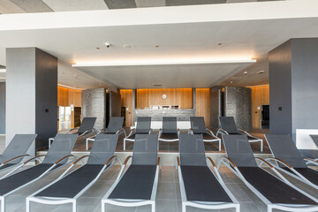 Sunbeds in indoor hotel spa and wellness center