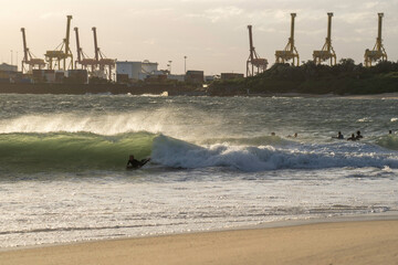 Sydney, NSW / Australia - August 26th 2019: Boogie boarder catching a steep wave at La Peruse in...