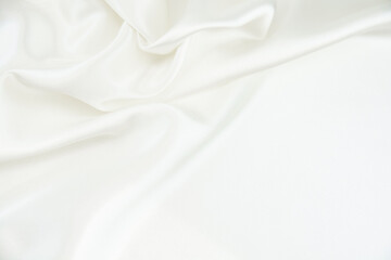 Fototapeta na wymiar White satin fabric with gentle curves