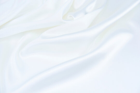White satin fabric with gentle curves © Shrayner