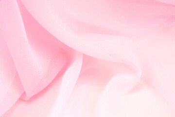 Obraz premium Pink satin fabric with delicate curves