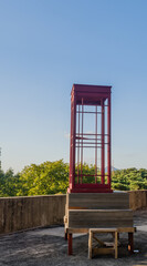  Wooden telephone booth on rooftop.