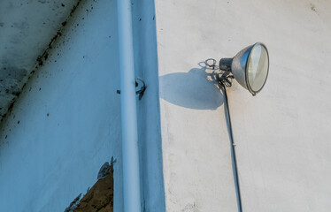 Flood light on concrete building