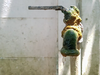 Old tap that has been used for a long time.