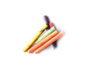 chalks in a variety of colors arranged on a white background