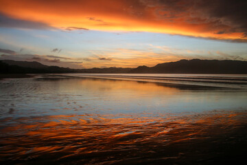 Colors of the sun in a sunrise over the beach