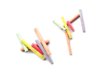 chalks in a variety of colors arranged on a white background