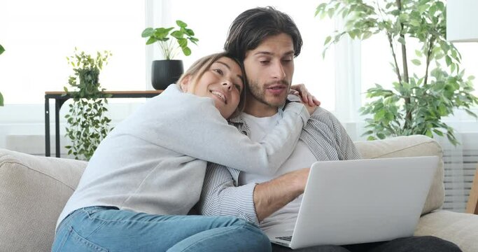 Couple Displeased While Shopping Online Using Laptop At Home