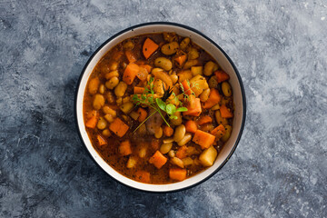 plant-based food, vegan sweet potato and pumpkin stew with butter beans and roasted veggies