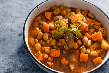 plant-based food, vegan sweet potato and pumpkin stew with butter beans and roasted veggies