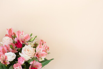 Beautiful bouquet of rose and alstroemeria flowers on light background.
